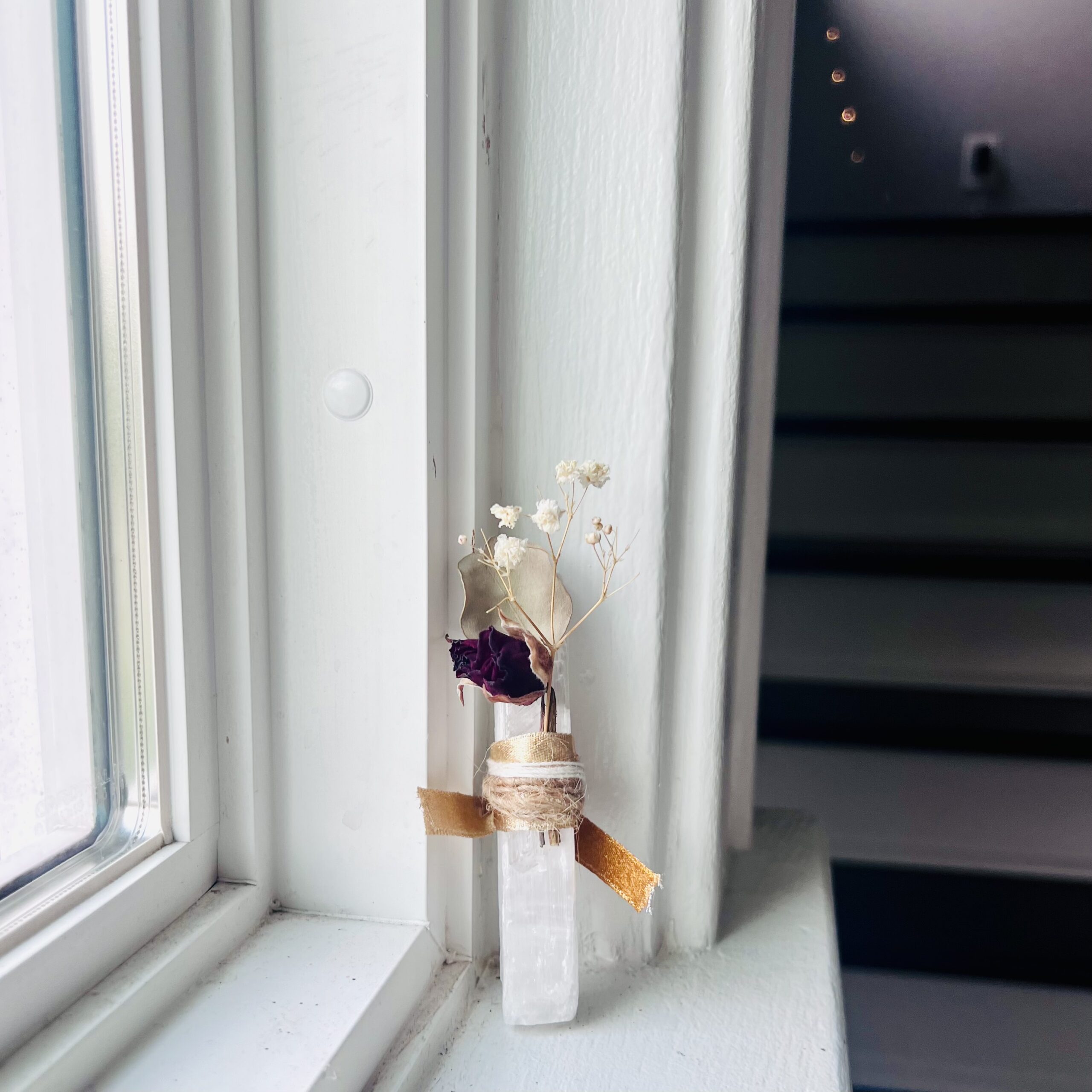 Selenite stick with rose flower and ribbon, image for online grief coaching