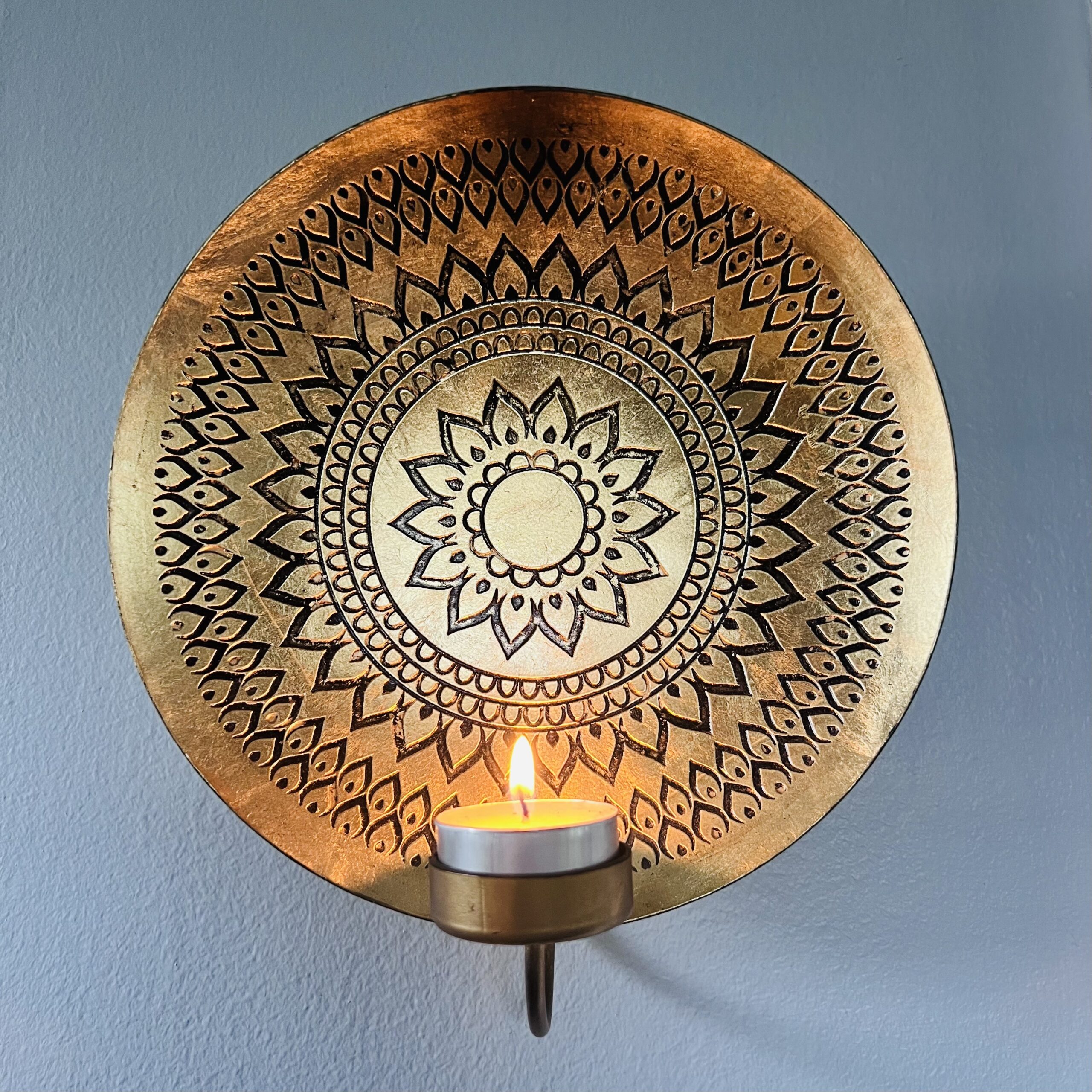 Candle with brass mandala design for online bereavement support by Grounded Grief Coaching